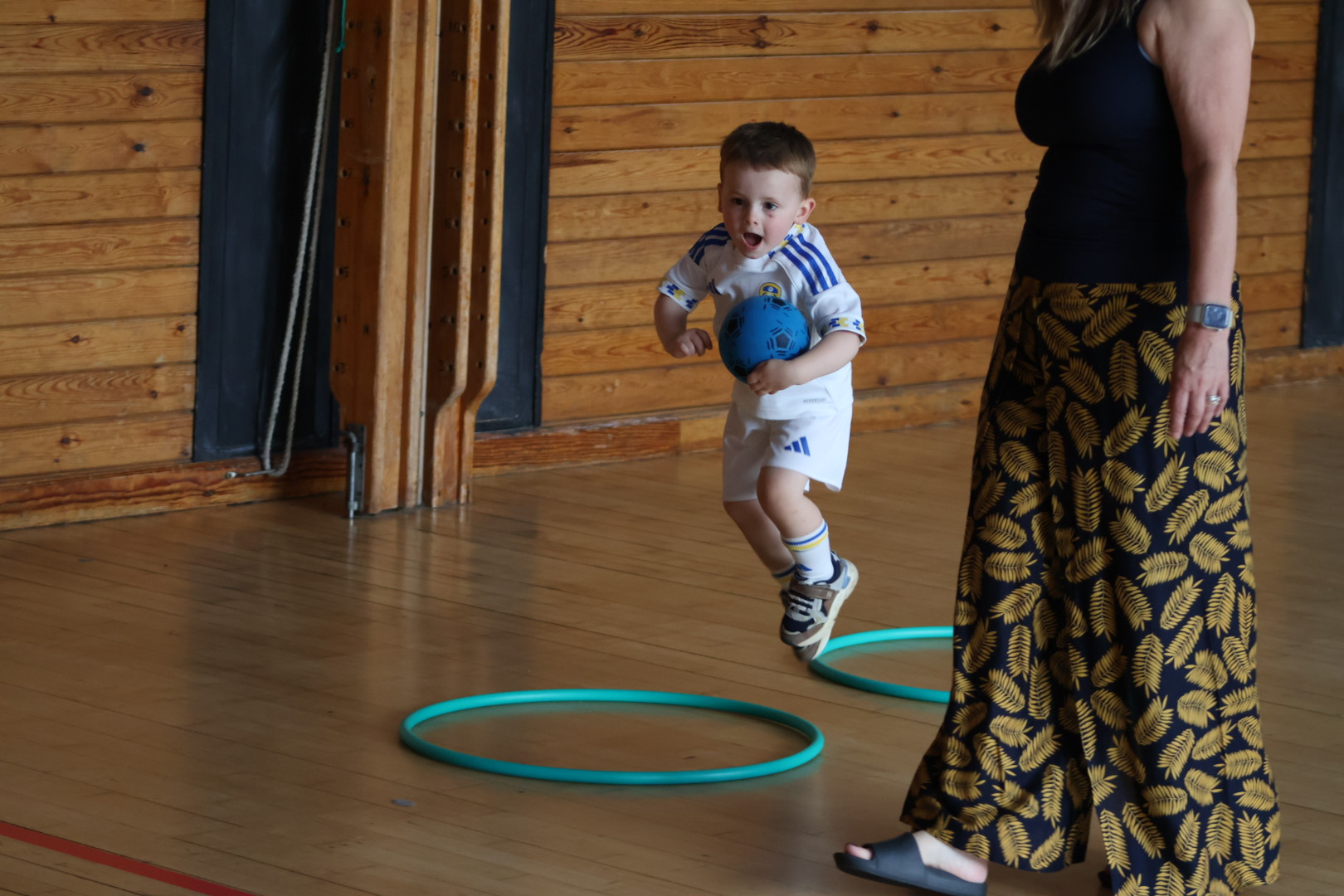 Parent and child enjoying a football activity